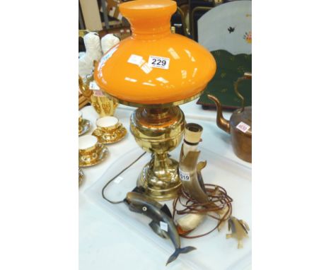 Brass lamp with orange glass shade