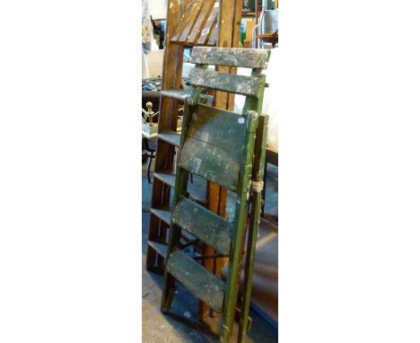Two pairs of wooden step ladders