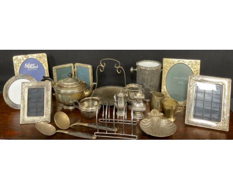 Plated ware - An EPNS teapot, other plated and metal ware including a Ronson style desk lighter, salts, photograph frames, et