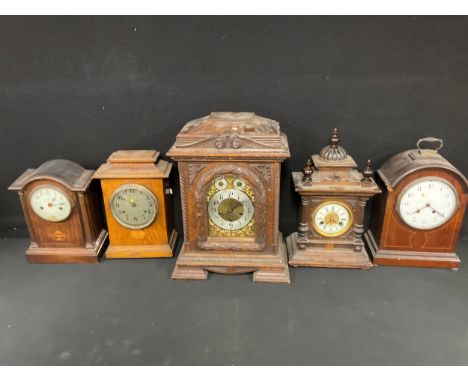 Clocks - a late 19th/eary 20th century oak bracket type mantel clock, 48cm high; a W.E. Watts, Derby, oak mantel clock, Green