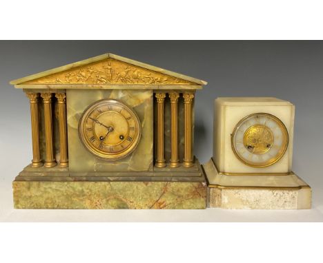 An early 20th century onyx architectural mantel clock, Roman numerals on circular dial, flanked on either side with three Cor