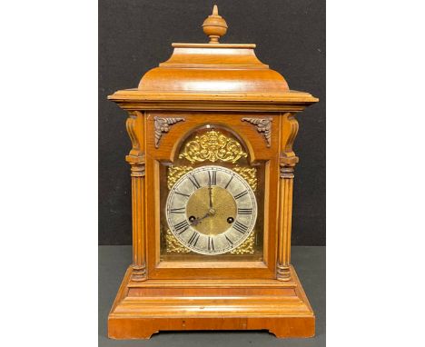 An early 20th century walnut bracket type mantel clock, Roman numerals on silvered chapter ring, twin winding holes, 47cm hig