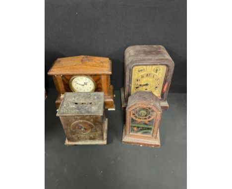 Clocks - an early 20th century oak mantel clock, Roman numerals on silvered dial, flanked by barley twist columns, 31cm high;