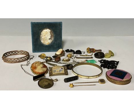 A 9ct gold earring marked 375, 0.8g; a 19th century oval carved shell cameo, 5cm high, blue velvet mount; a gold plated bangl
