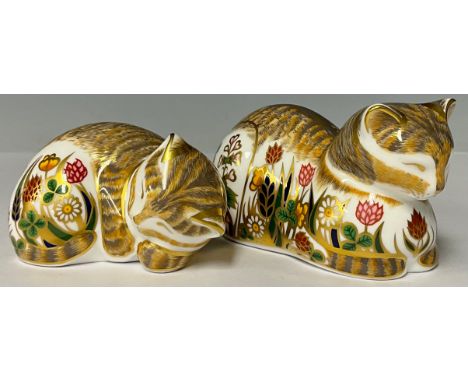 An associated pair of Royal Crown Derby paperweights, Cottage Garden Cat, red printed marks and Royal Crown Derby stamp on th