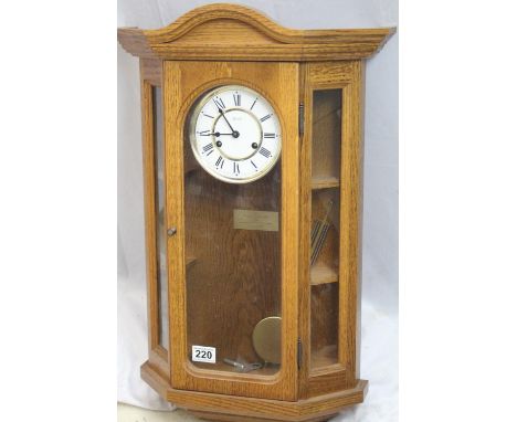 Modern chiming German Hermle wall clock, brass plaque with dedication inside case, in excellent condition 