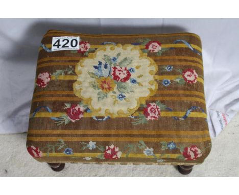Upholstered footstool with tapestry floral design, turned wooden legs 