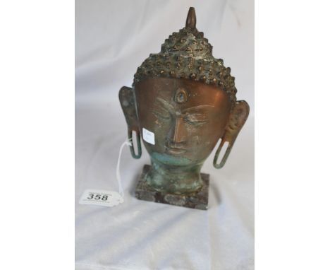 Bronze Buddha head mask on marble base 