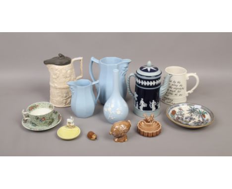 A quantity of collectable pottery including Wade, Copeland Spode, sealed Beswick Beneagles Scotch Whisky decanter etc.