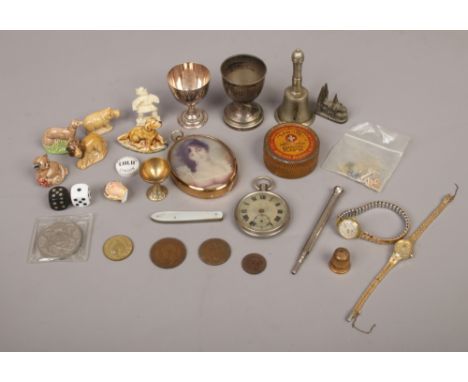 A quantity of collectables including a penknife with mother of pearls scales, silver plate egg cups, vintage advertising tin,