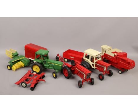 A collection of tin plate toy vehicles, all farming related to include International tractors / combine harvester John Deere 