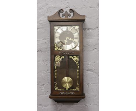 A President 31 day wall clock chiming on a coiled gong.