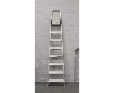 A pair of aluminium 7 rung step ladders.