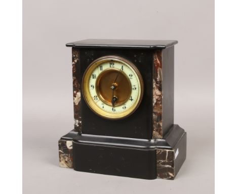A Victorian black slate 30 hour mantle clock with marble embellishments with key and pendulum.