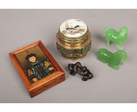 A group of Chinese collectables including a monkey netsuke, two jade coloured glass ornaments of horses, a brass and porcelai