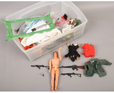 A tub of vintage 1960s and 70s Action Man accessories along with a lion rock figure.