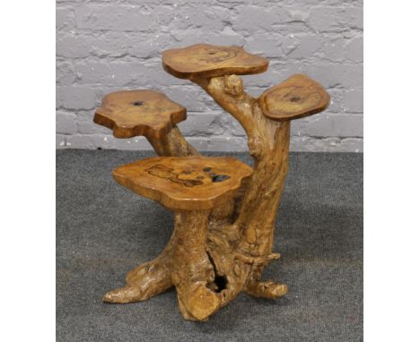 A decorative tree trunk display stand, height 51.5cm.