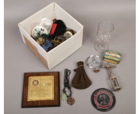 A box of collectables to include Mercedes badge, Three Tuns rummer, corkscrew etc.