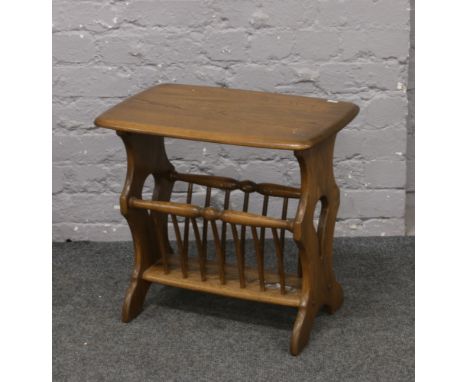 An Ercol Golden Dawn magazine rack / occasional table.