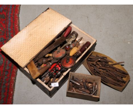 A box of mostly woodworking tools.