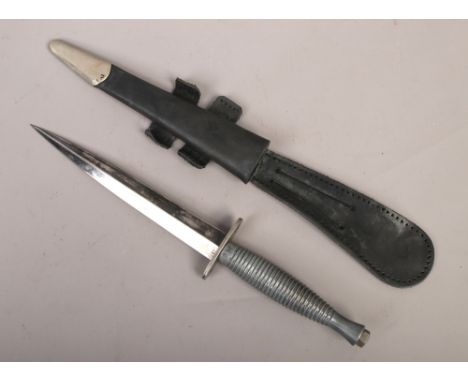A military issue Commando dagger by J. Nowill &amp; Sons of Sheffield in black leather sheath.&nbsp;Condition report intended