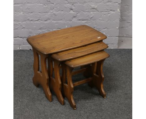 A nest of three Ercol Golden Dawn occasional tables.