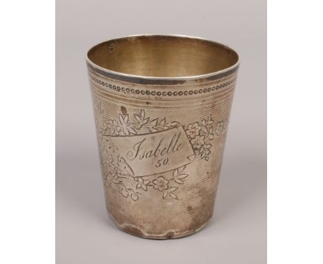 A 19th century Continental silver beaker of tapering form with an engine turned engraved ground decorated with flowers, a bir