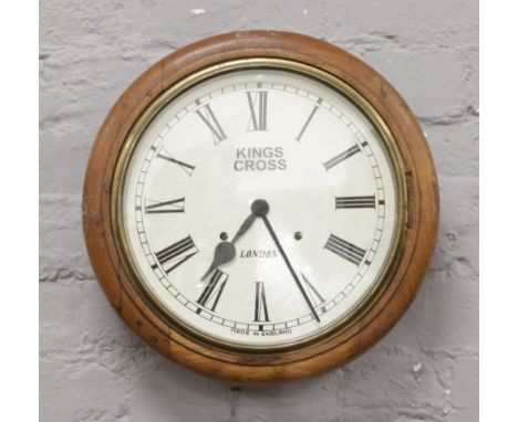 An early 20th century mahogany school / station wall clock with later dial.