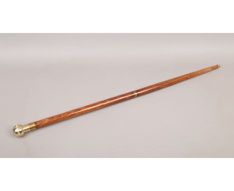 A sectional hardwood walking stick with brass mounts, concealed compass and spirit flask.