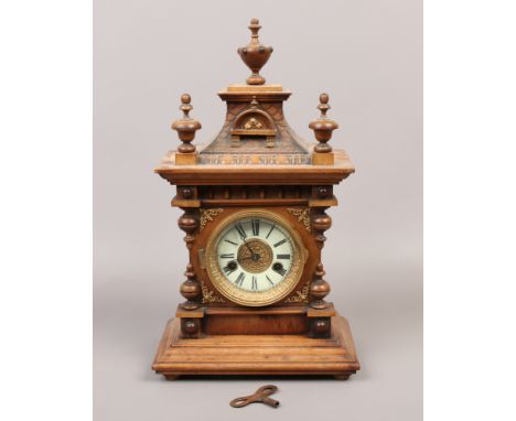 A German H.A.C 14 day mahogany cased mantle clock, chiming on a coiled gong with pendulum.