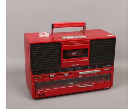 A Panasonic SG - J555L music system with built in record player.