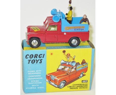 Corgi Toys Chipperfields Circus Land Rover Parade Vehicle (487). In bright red and light blue, complete with clown and monkey