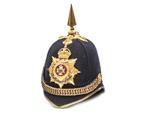 A post 1902 officer’s blue cloth spiked helmet of The Royal Sussex Regiment, gilt top mount and spike, ear rosettes, velvet b