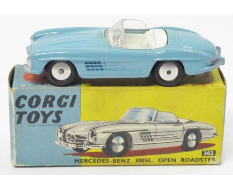 A Corgi Mercedes-Benz 300SL Open Roadster (303). An example in light blue with white interior, spun wheels example. Boxed, mi