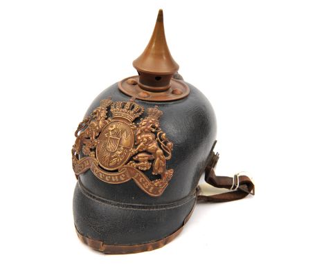 A Bavarian pickelhaube, the leather skull with brass badge and mounts, leather lining and original leather chinstrap, the ins