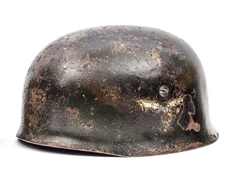 A Third Reich Luftwaffe parachutist’s helmet, the skull with ET maker’s mark (Eisenhuttenwerke, Thale), with textured dark gr