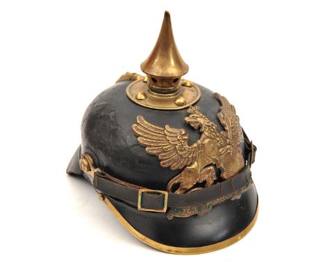 A Baden pickelhaube,  with brass badge and mounts and original leather chinstrap. Basically GC (no lining or rosettes, slight