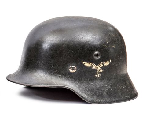 A Third Reich M40 single decal Luftwaffe steel helmet,  the dark grey/black finish with 2nd type eagle decal, with lining and