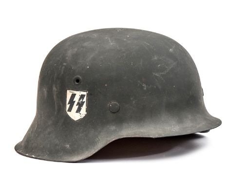 A Third Reich M42 Waffen SS steel helmet, matt grey finish with 2nd type SS decal, later worn type pale leather liner with “6