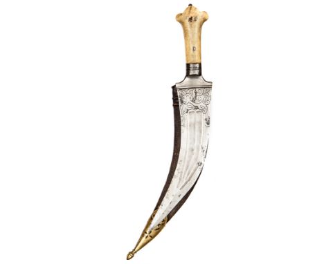 An early 19th century Indian jambiya, curved blade 9”, with etched foliate panels at forte, shallow stylized twin fullers, ta