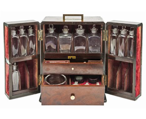 An early 19th century apothecary’s mahogany cabinet, the front opening to reveal shelves for 4 large and 2 small (5 missing) 