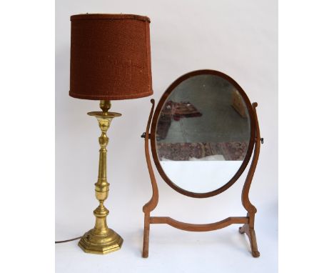 A turned brass table lamp, together with an oval adjustable dressing mirror