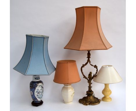 A gilt metal table lamp, an Oriental table lamp, and two others
