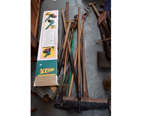 A lot of wooden handled garden tools to include two spades and a billhook