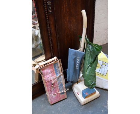 A vintage hoover, and accessories