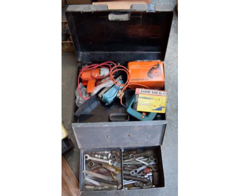 A box of Black and Decker power tools including circular saw and corded drill, along with a metal work box containing a quant