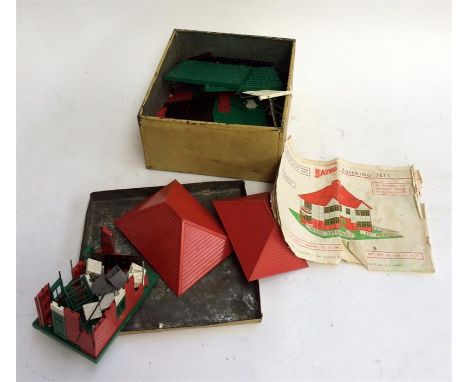 A vintage tin containing a Bayco building set