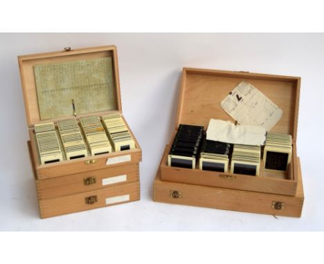 A collection of vintage plastic photographic slides in five wooden slide boxes