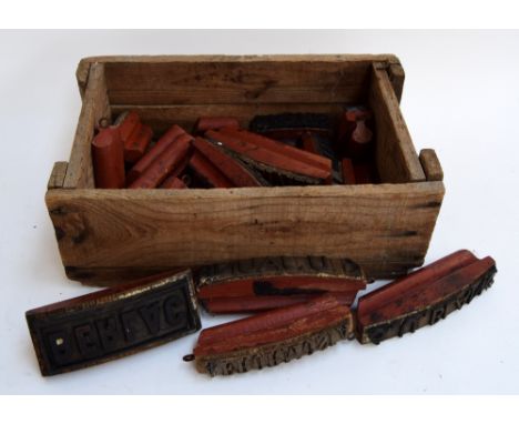 A small wooden crate of vintage French rubber printing blocks (20)