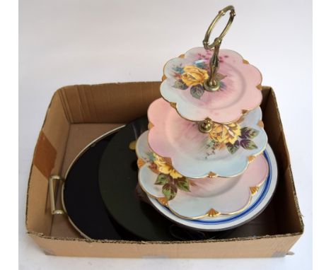 A mixed lot to include a black glass and metal tray, several plates, a copper and ceramic warming plate, and a lacquered wood